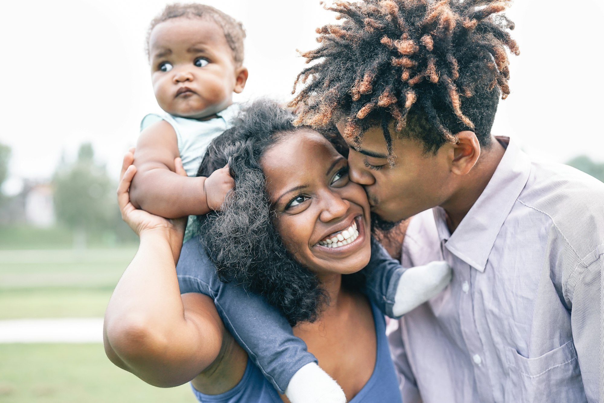 Happy black family having fun in a park outdoor